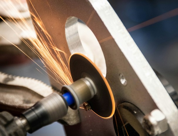 Metal finishing station where deburring smooths out sharp edges on parts.